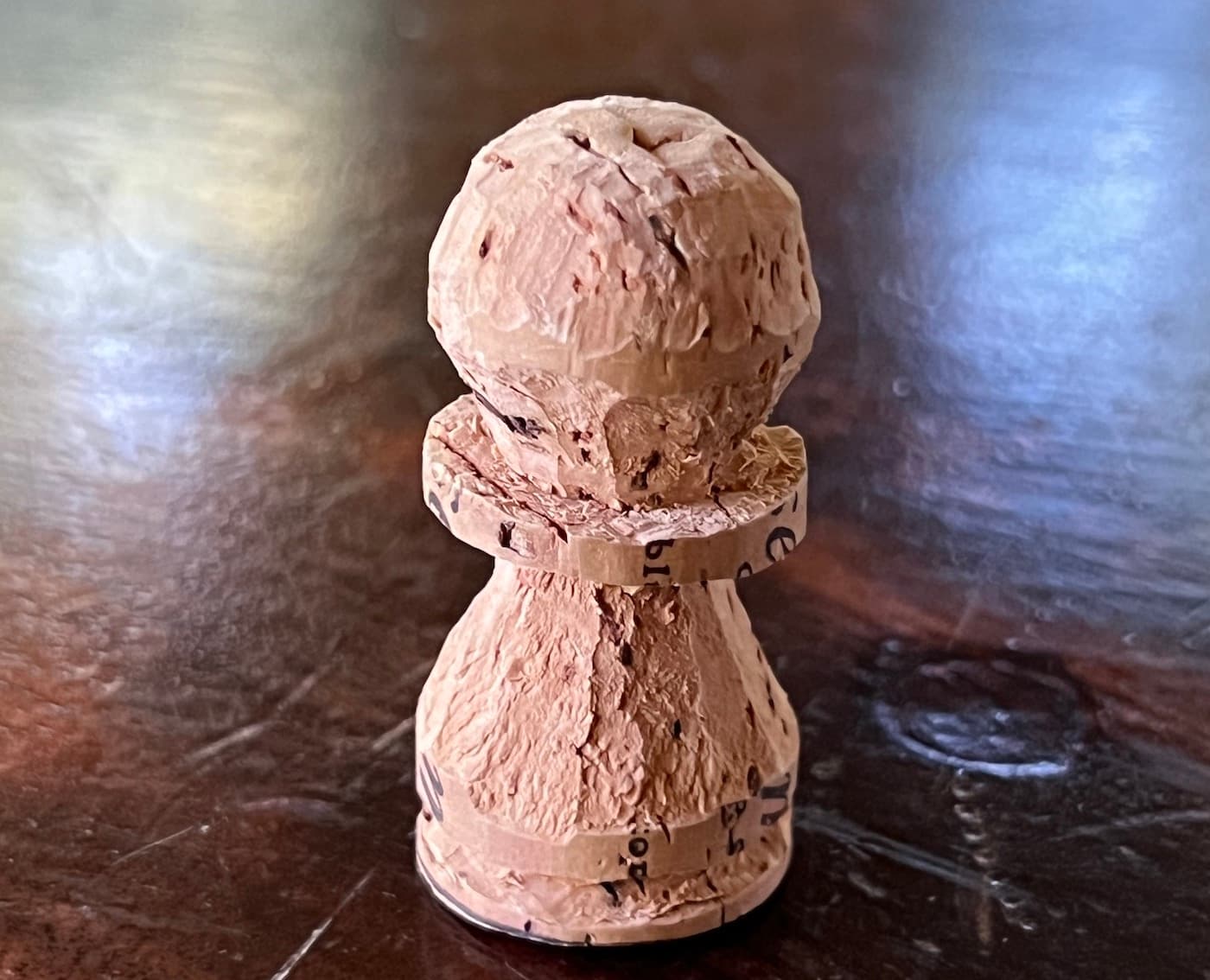 White pawn carved from a cork